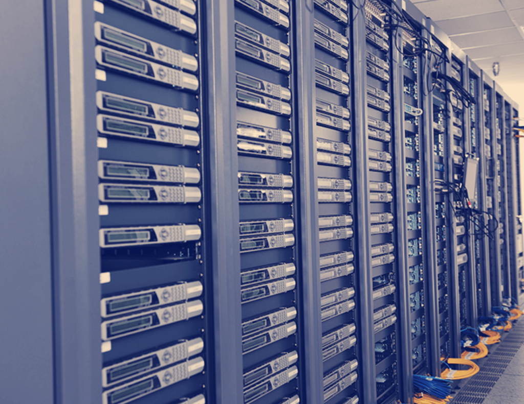 Close-up of bundled network data cables and patch panel in a server rack.